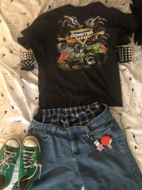 A pair of jeans, a t-shirt, and a pair of green shoes.