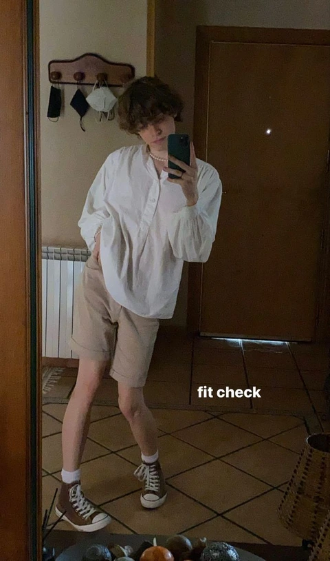 A man taking a picture of himself in a mirror.