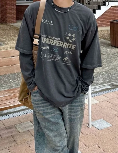 A mannequin wearing a black shirt and jeans.