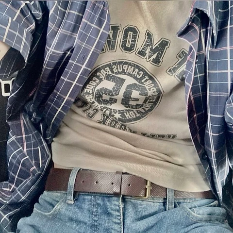 A man wearing a shirt with a logo on it.