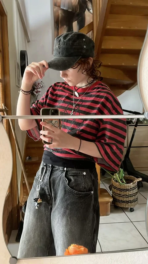 A woman taking a picture of herself in a mirror.