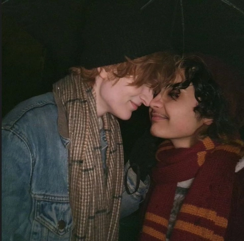 A couple of people that are standing next to each other.