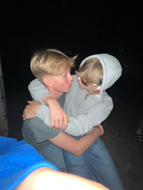 A couple of people that are hugging each other.