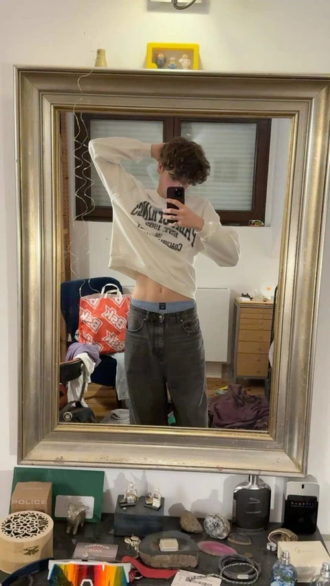 A man taking a picture of himself in a mirror.