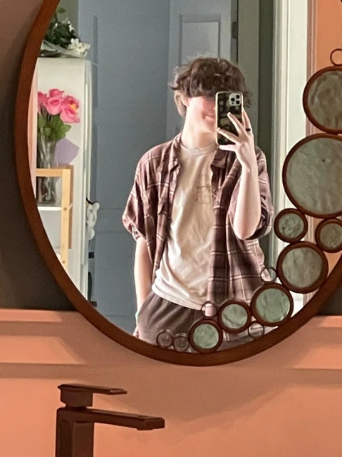 A woman taking a picture of herself in a mirror.