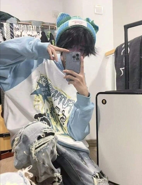 A person taking a picture of themselves in a mirror.