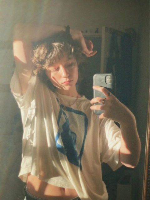A woman taking a picture of herself in a mirror.