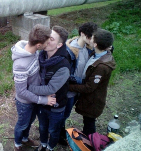 A group of young men standing next to each other.