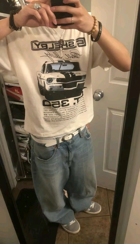 A person taking a picture of themselves in a mirror.