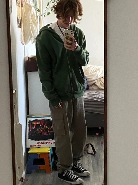A man taking a picture of himself in a mirror.