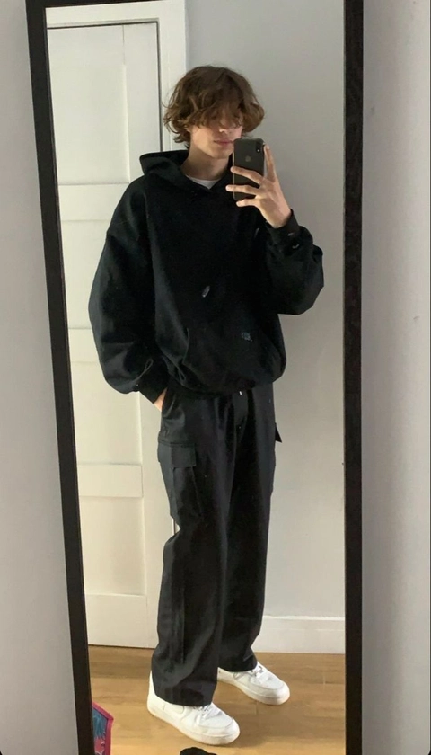 A man taking a selfie in a mirror.