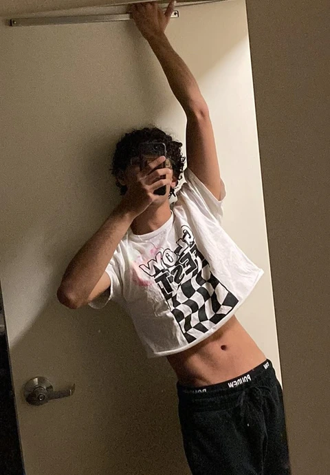 A man taking a picture of himself in a mirror.