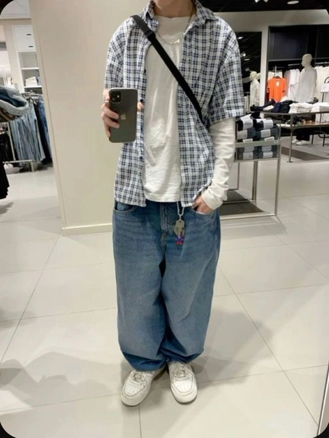 A man taking a selfie in a mirror.