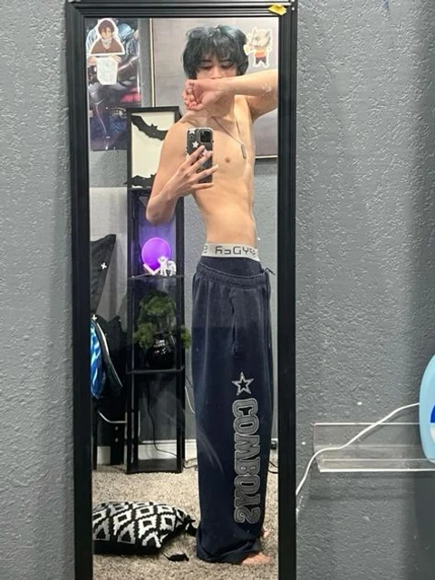 A man taking a picture of himself in a mirror.