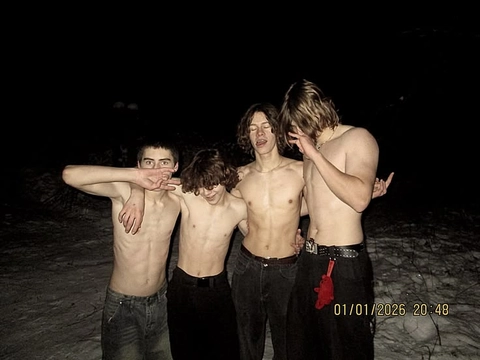 A group of young men standing next to each other.