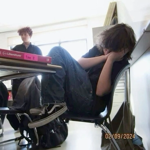 A group of people sitting on top of a chair.