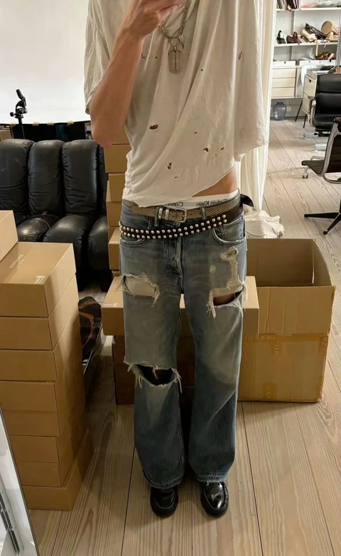 A man taking a selfie in a mirror.