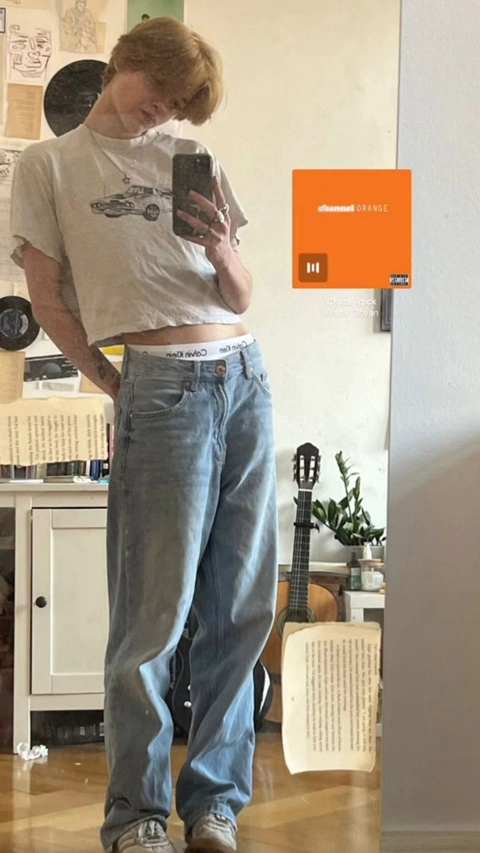 A man taking a picture of himself in a mirror.