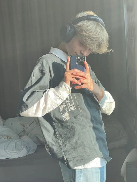 A woman taking a picture of herself in a mirror.