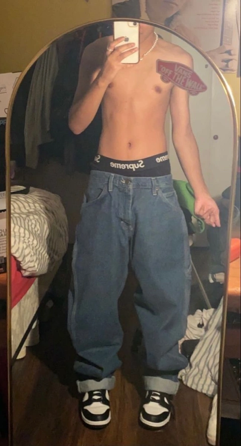 A man taking a picture of himself in a mirror.