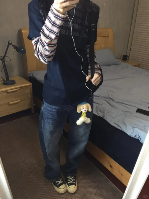 A person taking a picture of themselves in a mirror.