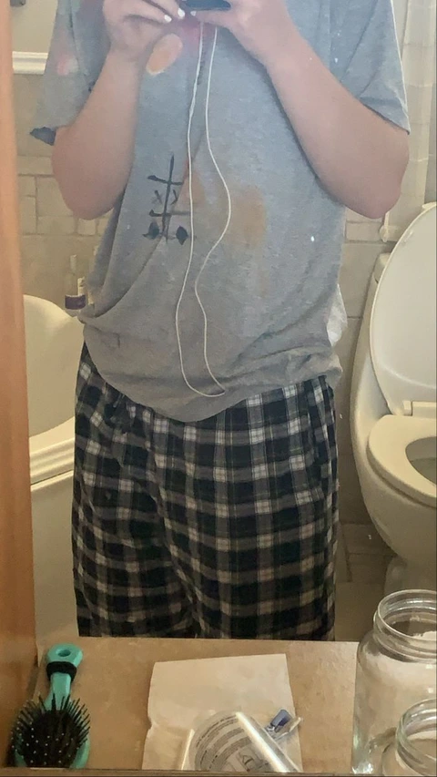 A man taking a picture of himself in a mirror.