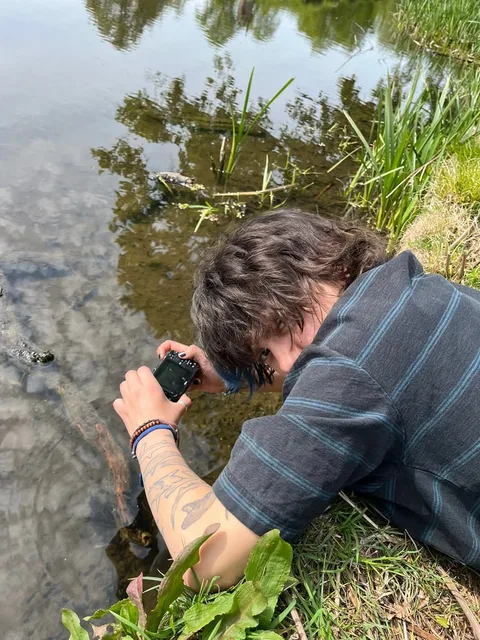 A man taking a picture of himself in the water.