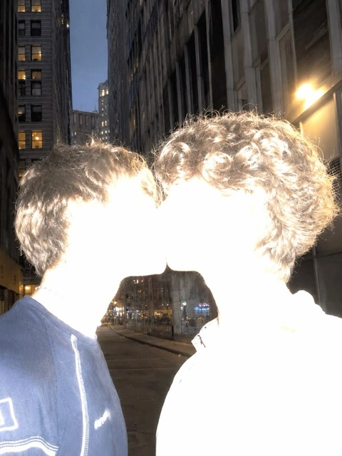A couple of people that are standing in the middle of a street.